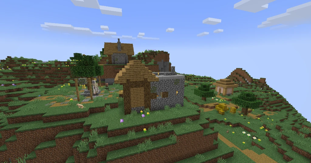 Terraced mountain houses and stacked hay bales climbing up the scenic green slopes