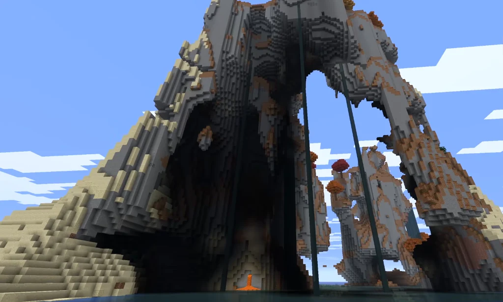 Dramatic low angle view looking into the massive hollow cavern of the monolith with cascading waterfalls and a lava flow